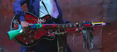 Man holding a guitar rifle