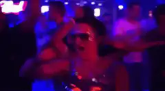 Woman dancing excitedly in club