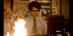 Man typing while desk on fire