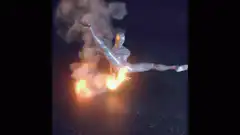 Silver man on fire spinning