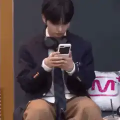 Man puts phone away and smiles