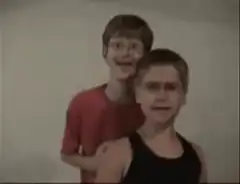 Two boys making funny faces