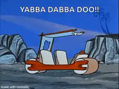 Fred Flintstone drives car off cliff