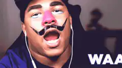 Man crying with drawn-on mustache