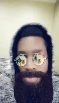 Man with beard and palm tree sunglasses