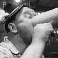 man drinking from bottle