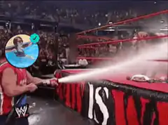 Wrestler sprays water on ring