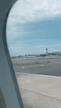 View from airplane window on runway