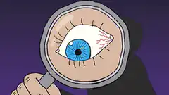 Magnifying glass inspecting a bloodshot eye