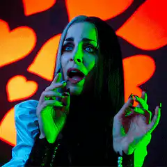 Woman with green hands and orange hearts