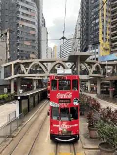 Red double-decker tram in city
