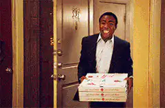 Troy Barnes with pizza in the loft