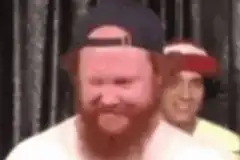 Bearded Man Nodding with Guy Behind