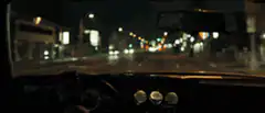 Driving through city at night