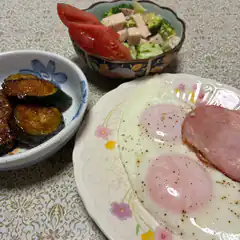 breakfast plate with eggs ham and salad