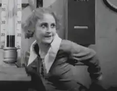 Woman looking at thermometer