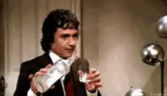 Johnny Carson pours water