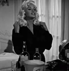 Marilyn Monroe playing with her hair
