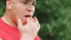 man eating and rubbing belly