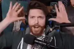 Man screaming with hands up