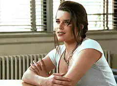 Neve Campbell laughs and smiles