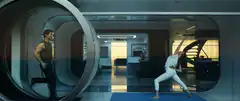 Man running on treadmill in futuristic room