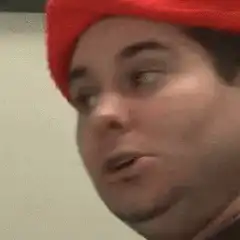Man in red hat triggered