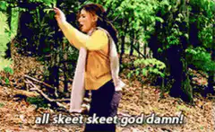 Woman throwing sticks in forest