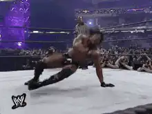 Wrestler does a backflip in the ring