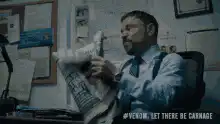 Man throws cat in trash can