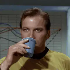 William Shatner drinking from a cup