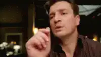 Jason Bateman shrugging and resting his head