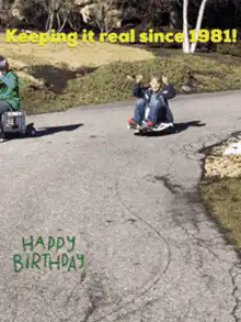 Kids sledding down a hill on skateboards