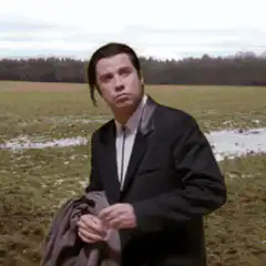 John Travolta confused looking around field