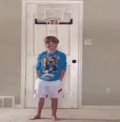 Kid knocked over by dunking man