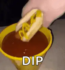 Hot dog dipped in sauce