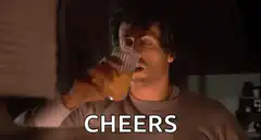 Sylvester Stallone cheers with a drink