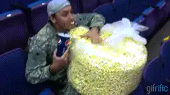 Man eating popcorn with nose