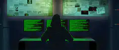 Hacker in dark room with green code