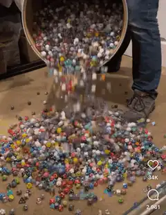 bucket of dice pouring out
