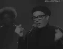 Jimmy Fallon singing with hands