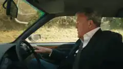 Steve Coogan driving and exiting car
