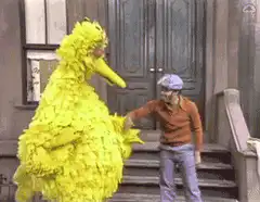 Big Bird and Mr. Rogers dance