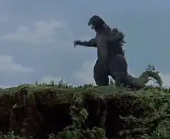 Godzilla standing on a cliff