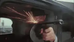 Man shooting gun from car window
