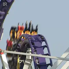 people on spinning roller coaster
