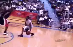 Basketball player dribbling between legs