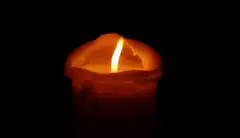 burning candle in the dark