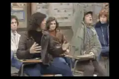 student raises hand enthusiastically
