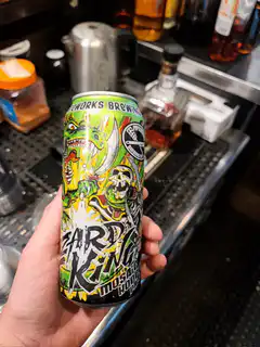 Hand rotating Lizard King beer can